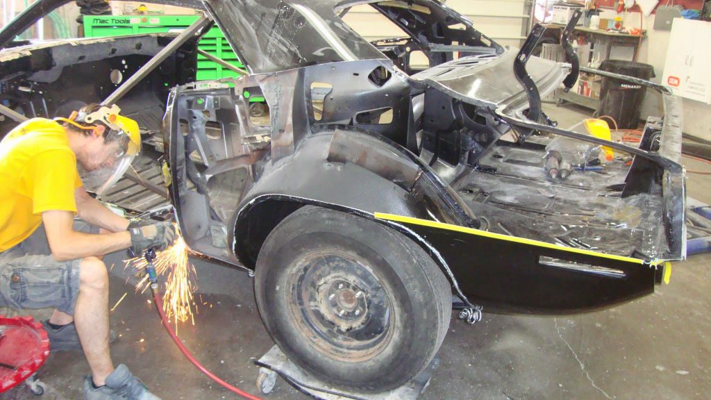 Photo of a 1970 Plymouth AAR Cuda having its driver's side quarter panel removed